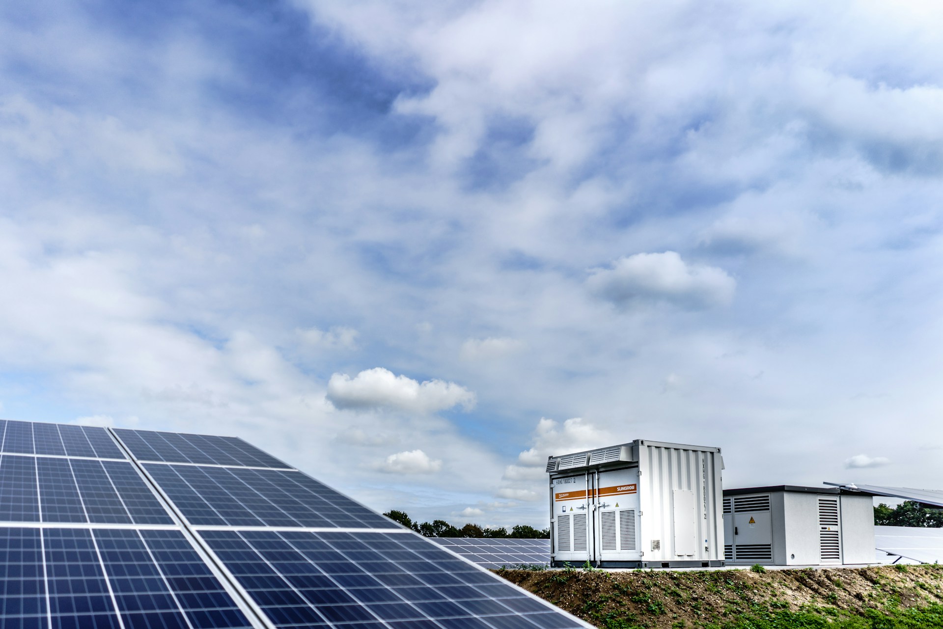 Battery storage containers and solar panels at energy facility