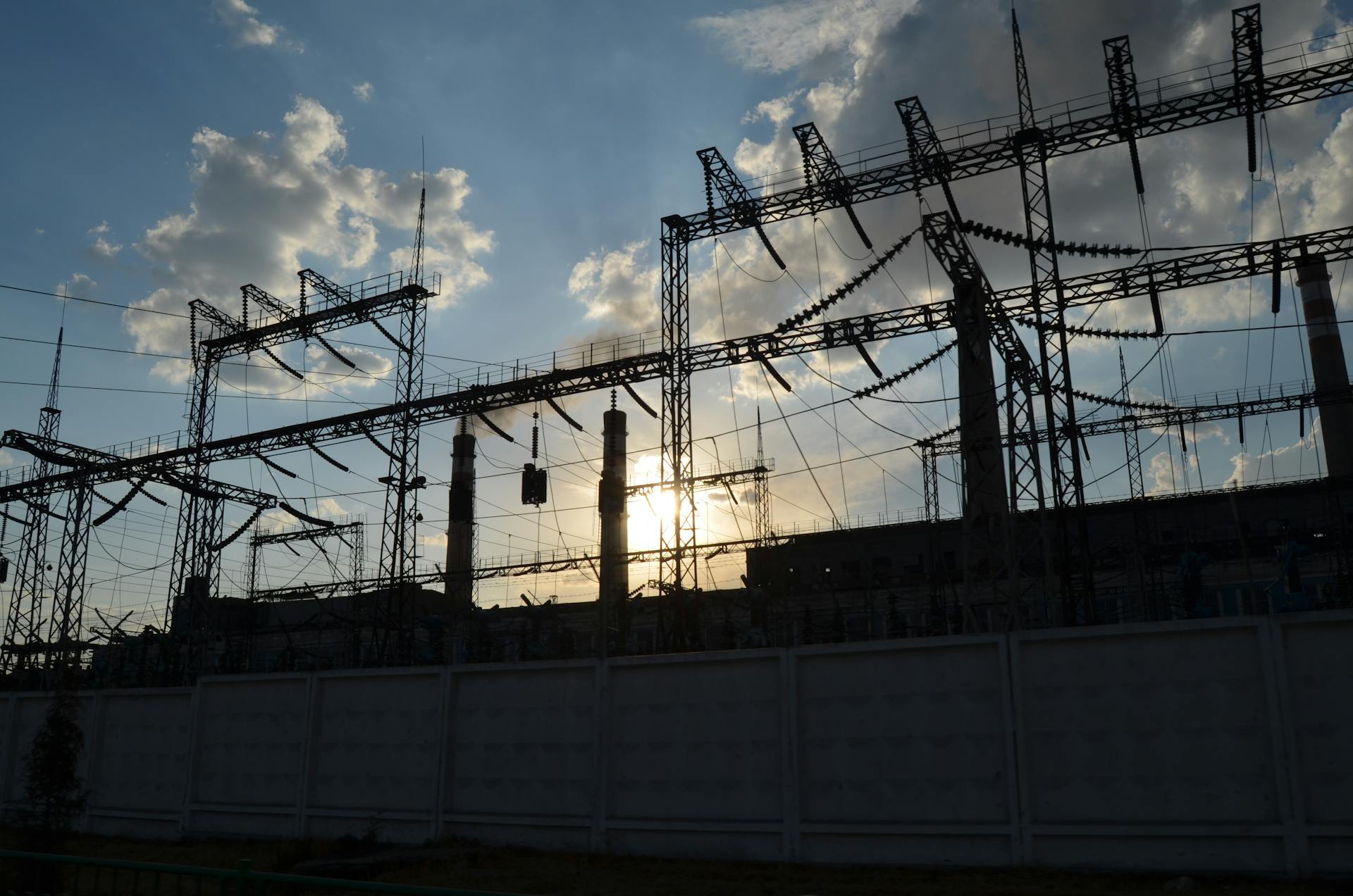 Substation switchyard silhouetted at sunset