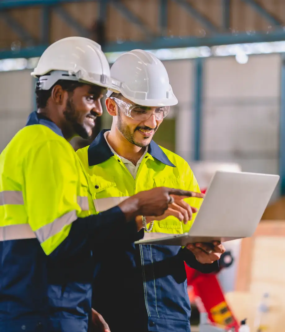 Electrical engineers reviewing systems in industrial facility