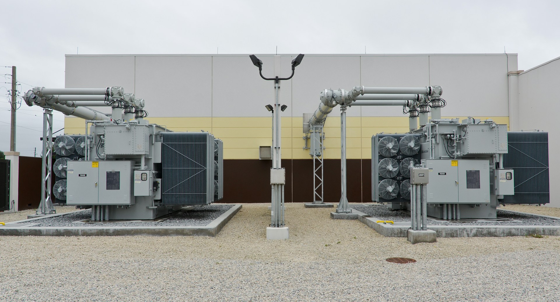 Dual oil-filled power transformers with cooling fans